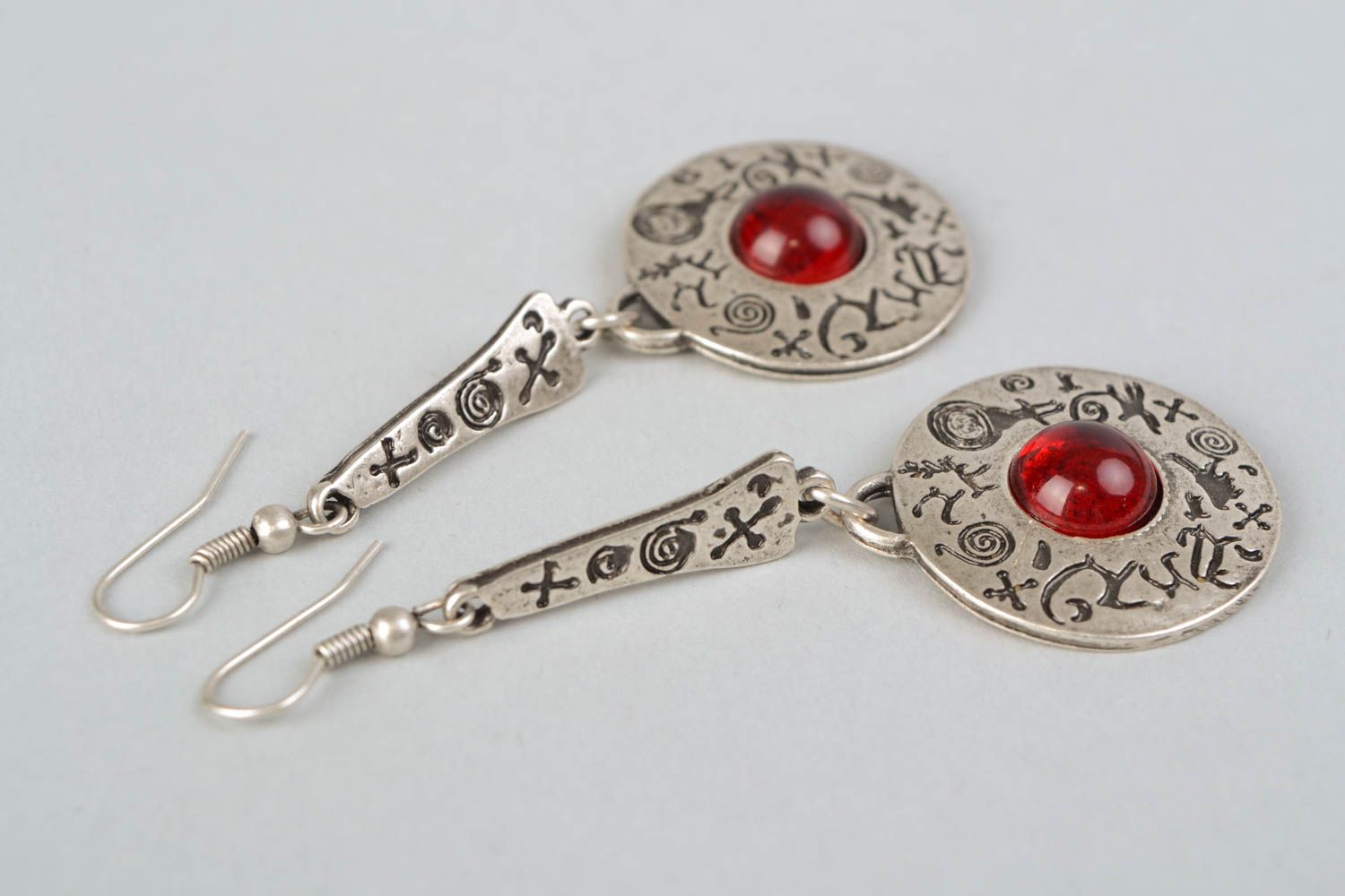 Long metal earrings with red cabochons photo 4