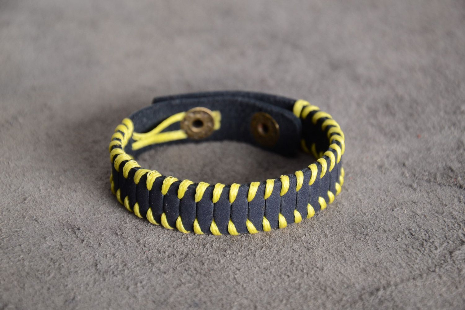 Handmade black genuine leather wrist bracelet with yellow cord and rivets photo 1