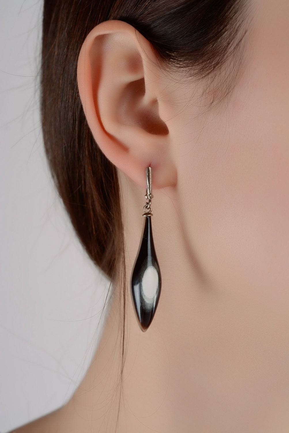 Silver earrings with cow horn photo 2