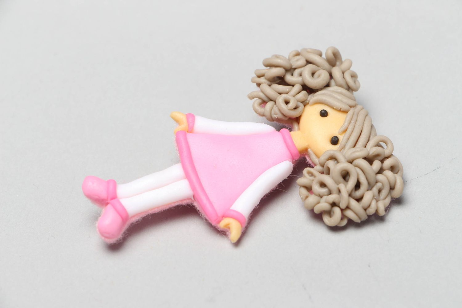 Plastic brooch in the shape of doll photo 1