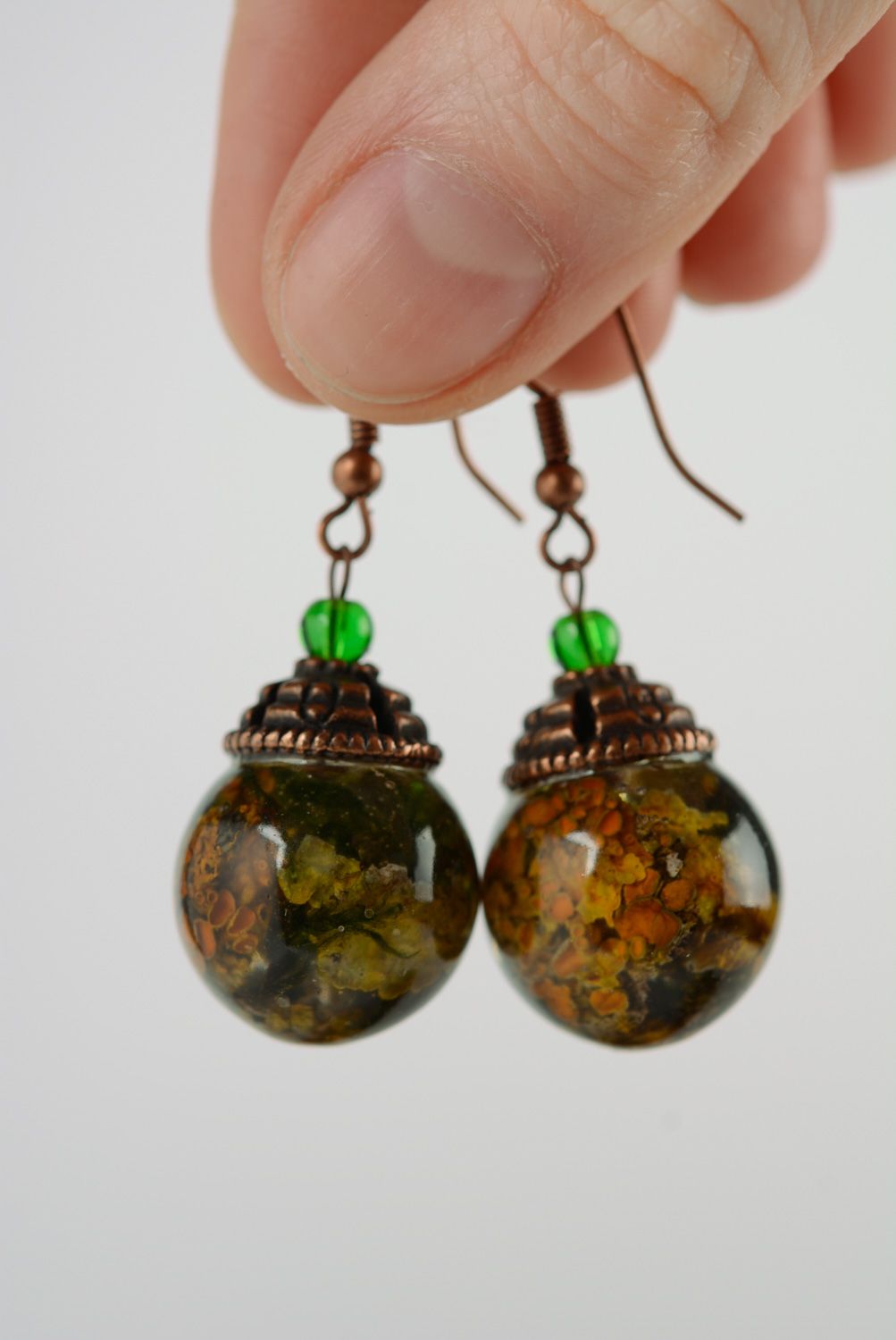 Handmade ball earrings with lichen plant coated with epoxy resin photo 2