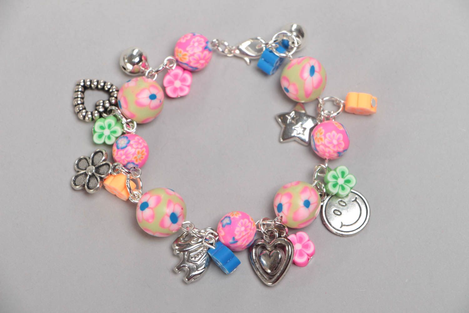Handmade designer children's pink wrist bracelet with plastic and acrylic beads photo 3