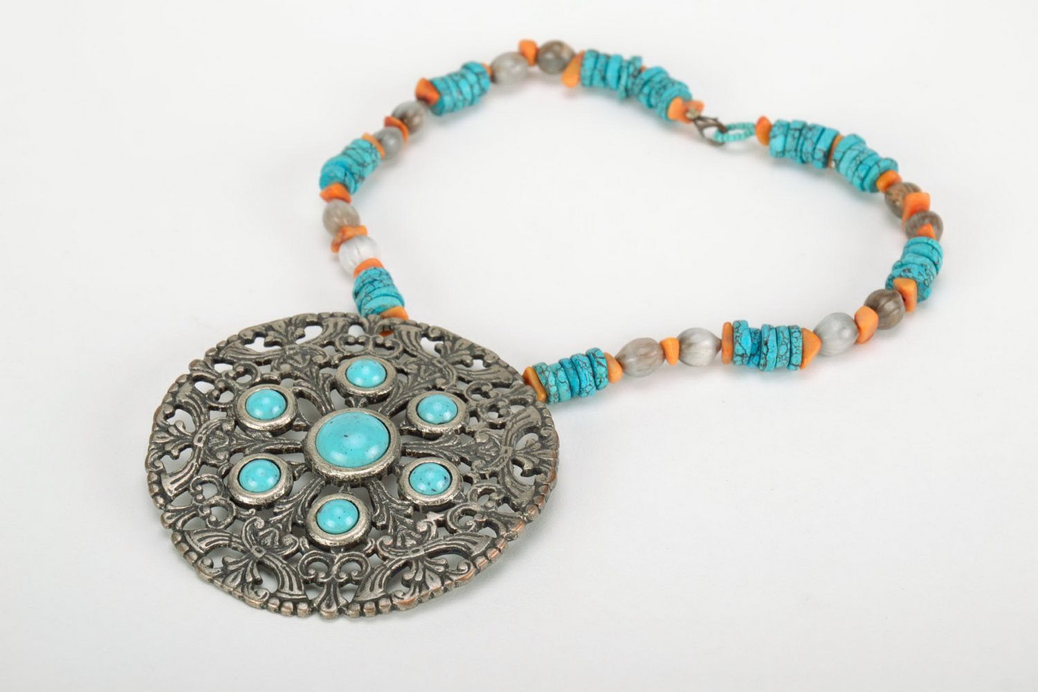Metal pendant with turquoise photo 1