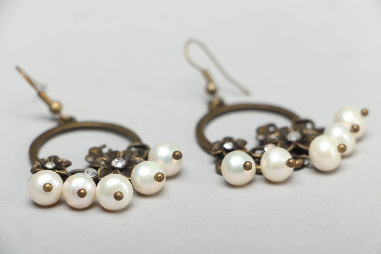 Metal earrings with flowers photo 2