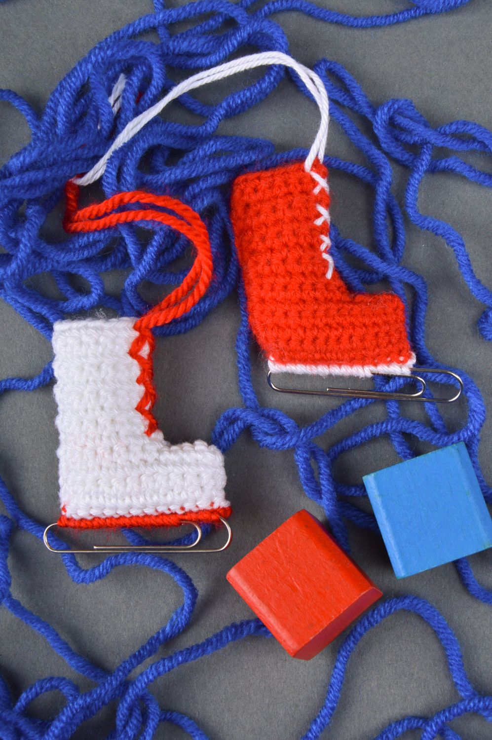 Unusual handmade crochet soft interior pendant in the shape of skates with paper clips photo 1