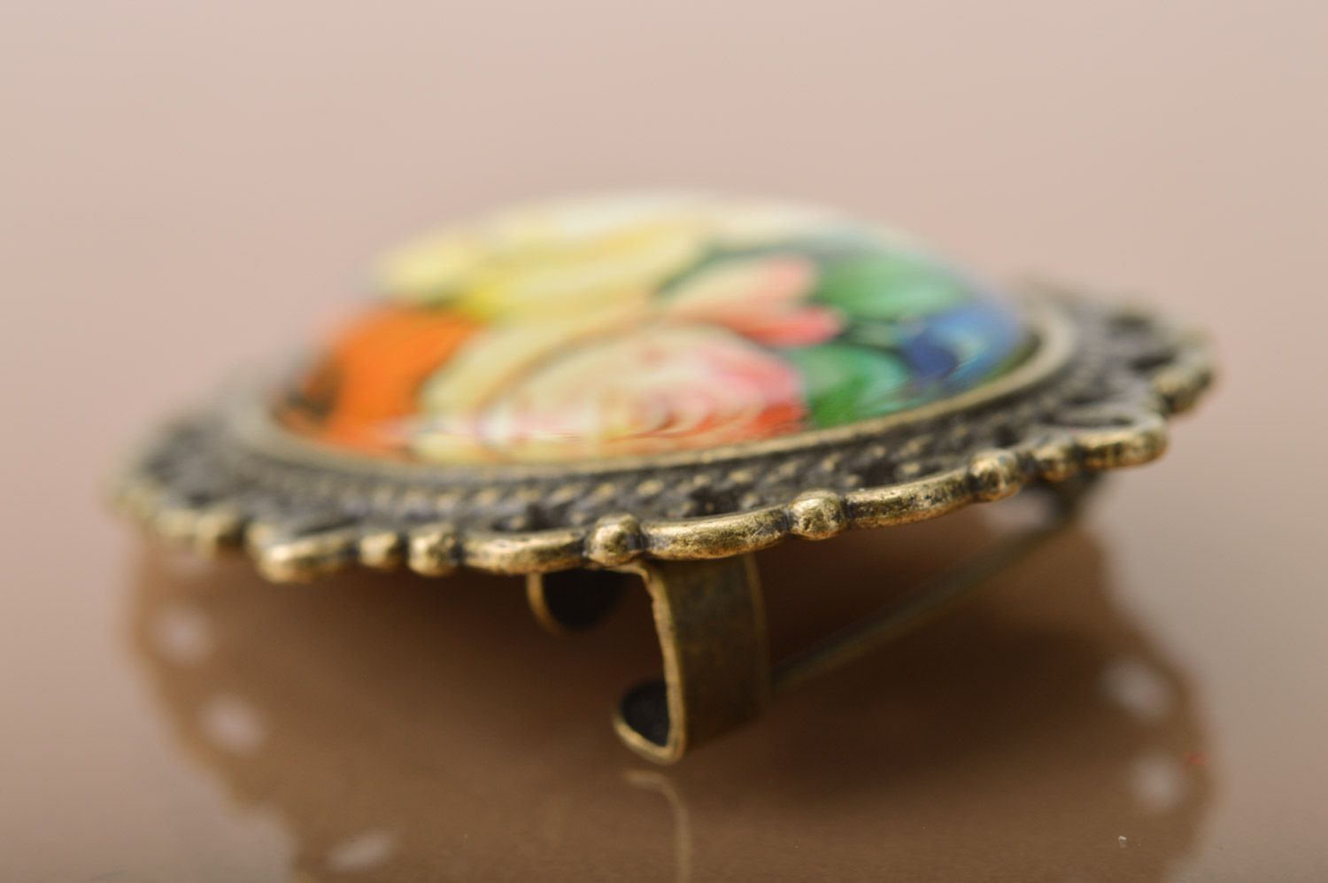Handmade oval brooch with metal basis and floral pattern coated with glass photo 4
