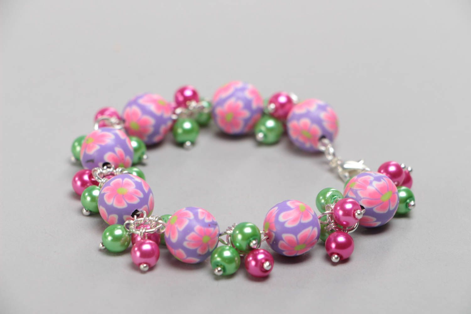 Handmade children's wrist bracelet with polymer clay beads and ceramic pearls photo 2