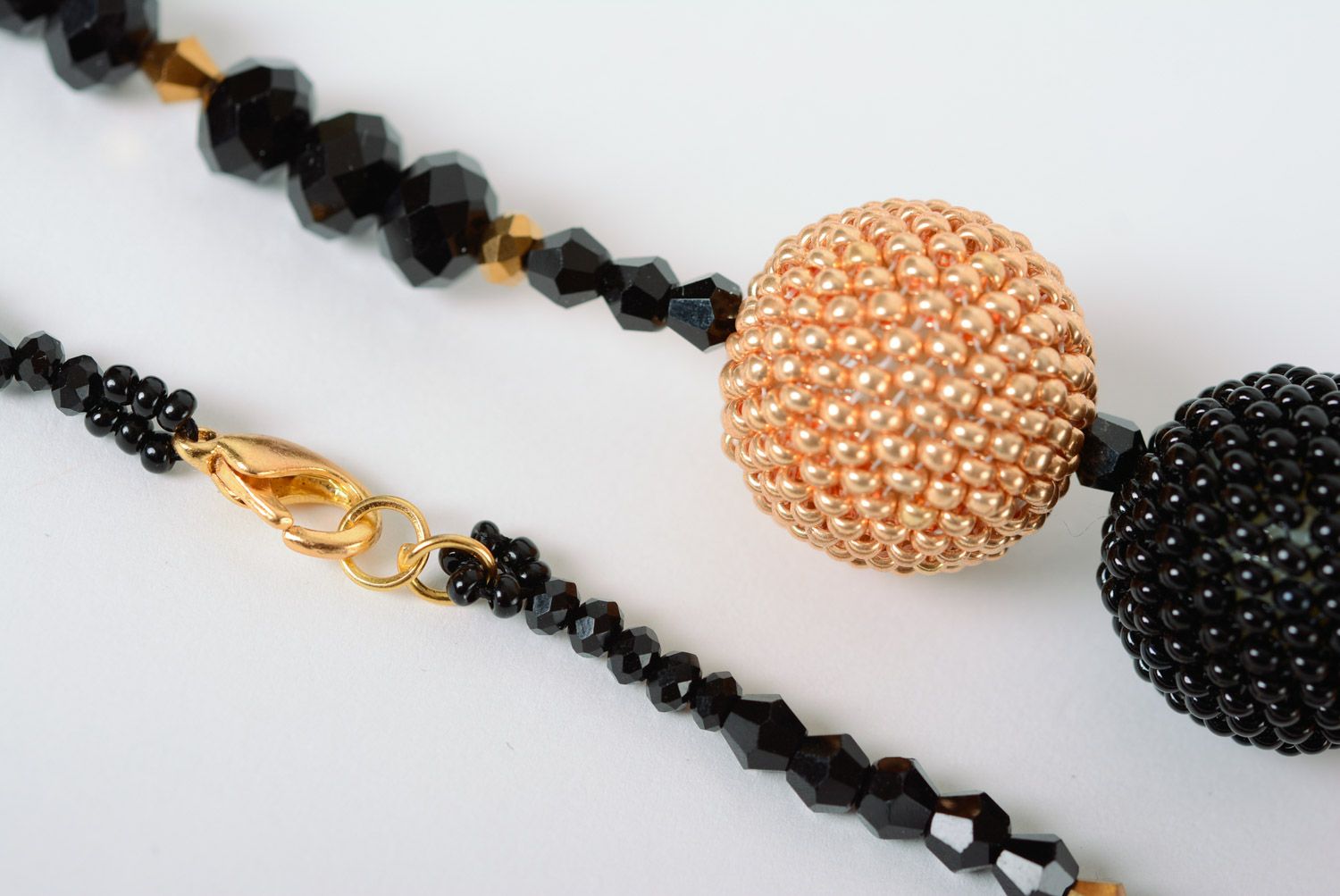 Elegant necklace with balls woven over with beige and black beads for women photo 5