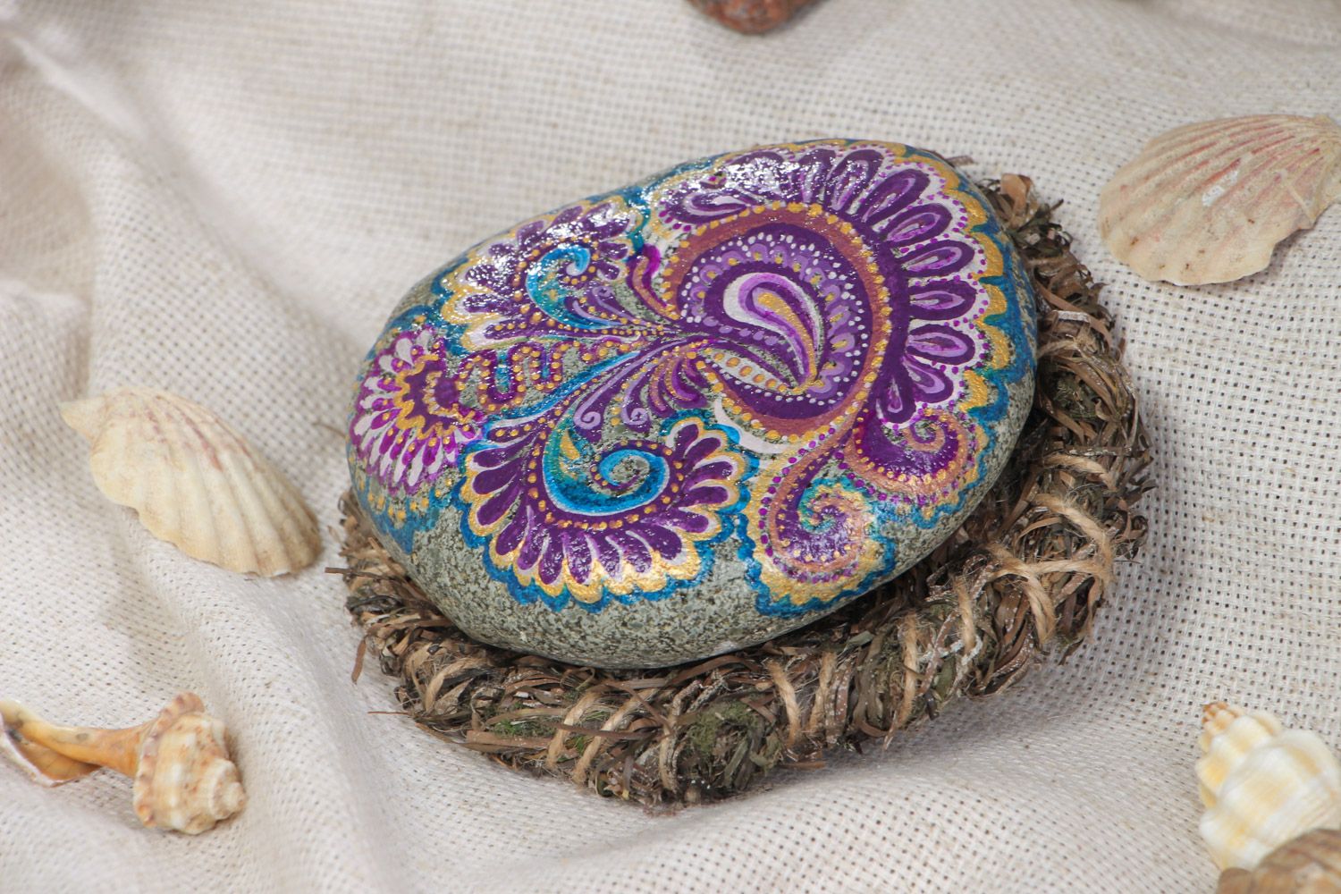 Small handmade painted sea stone with woven seaweed holder for decor photo 1