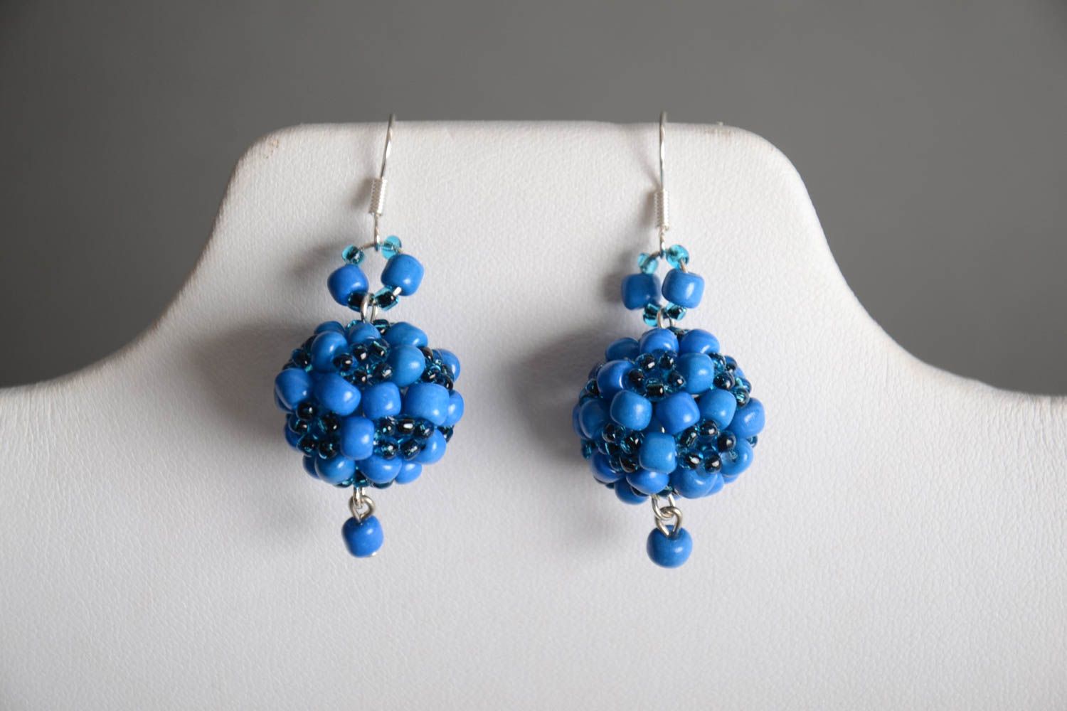Handmade designer ball shaped dangling earrings crocheted of blue Czech beads photo 1