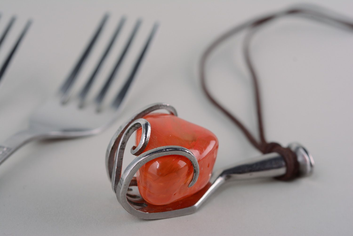 Handmade metal pendant made of cupronickel fork with red artificial stone photo 1