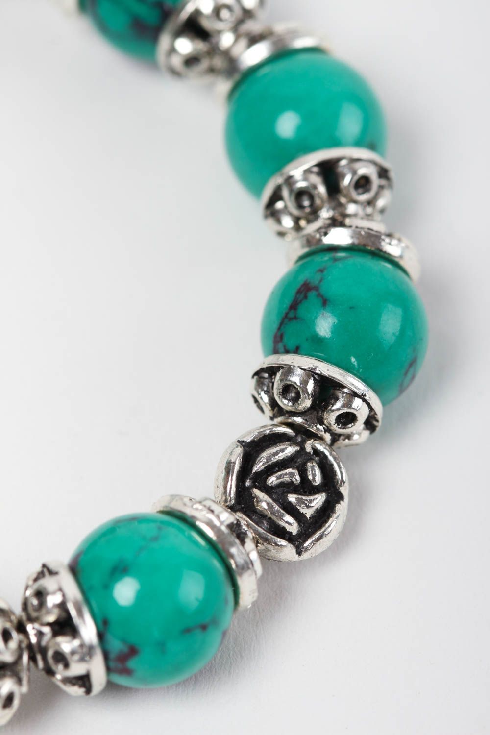 Natural turquoise stone beaded wrist bracelet with metal charms and central butterfly charm photo 4