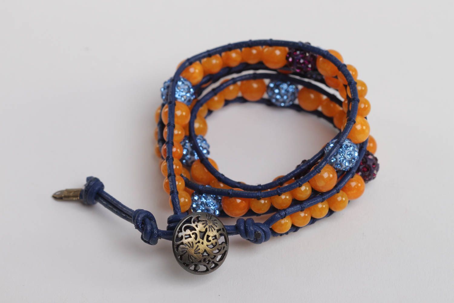 Three-layer orange beads strand bracelet on dark blue cord photo 4