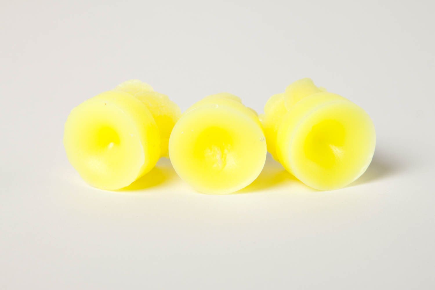 Handmade beautiful candles bright yellow candles 3 cute decor elements photo 5