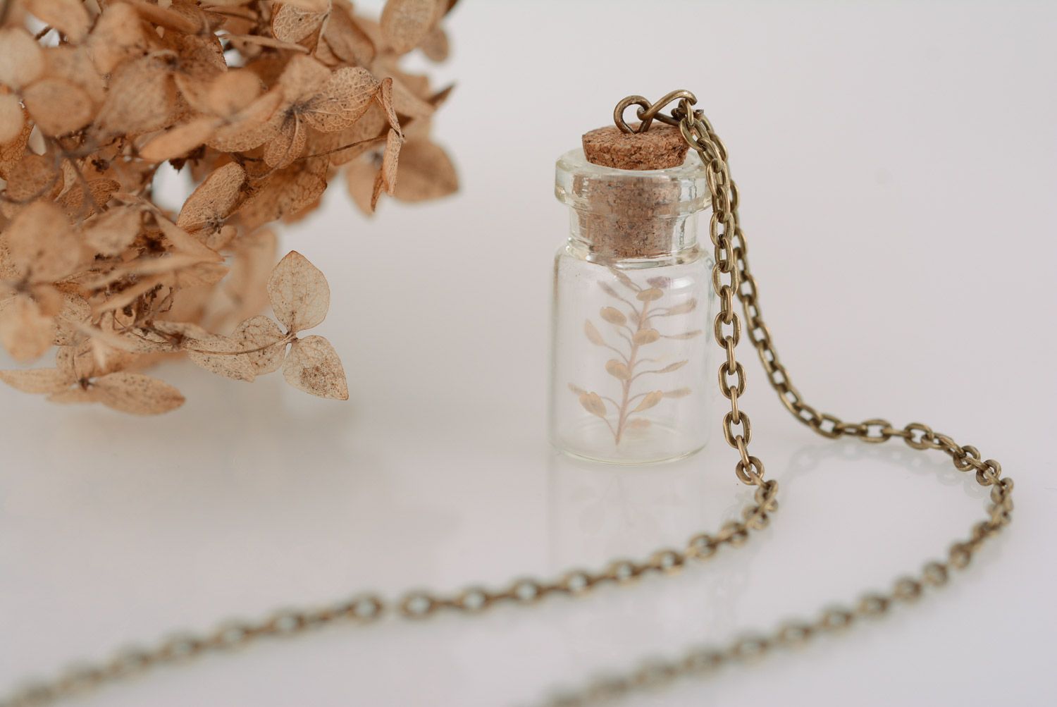 Handmade glass neck pendant in the shape of jar with plant inside with long chain photo 1