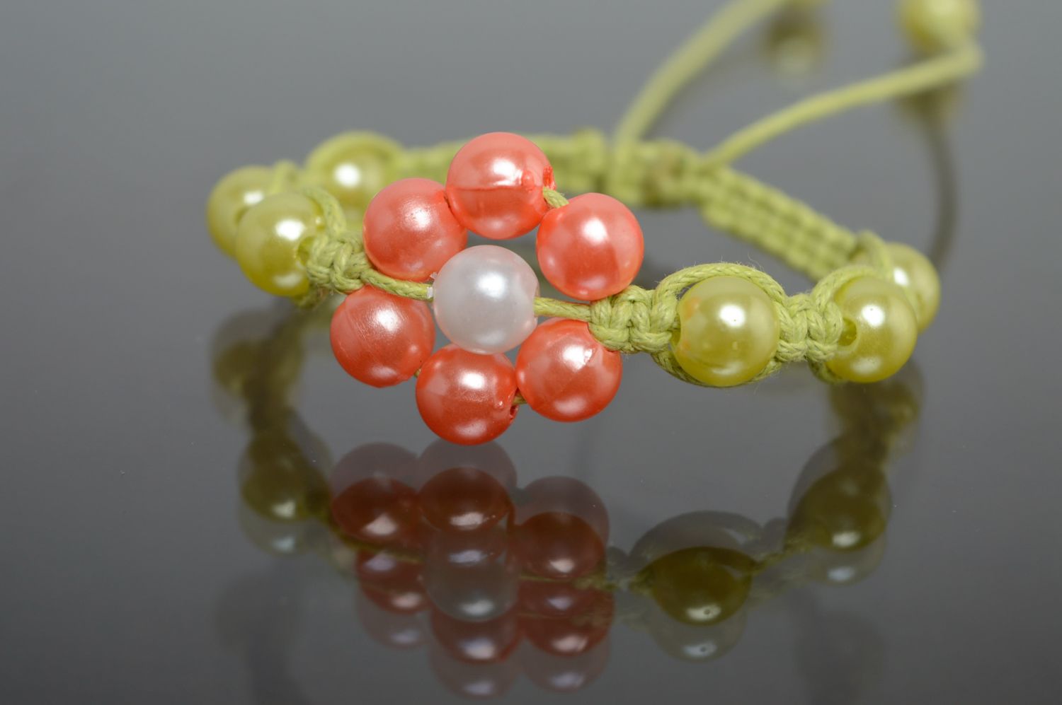 Woven macrame cord bracelet with ceramic beads photo 1