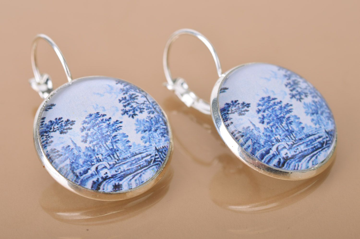 Handmade metal round dangle earrings with landscape print in white and blue colors photo 2
