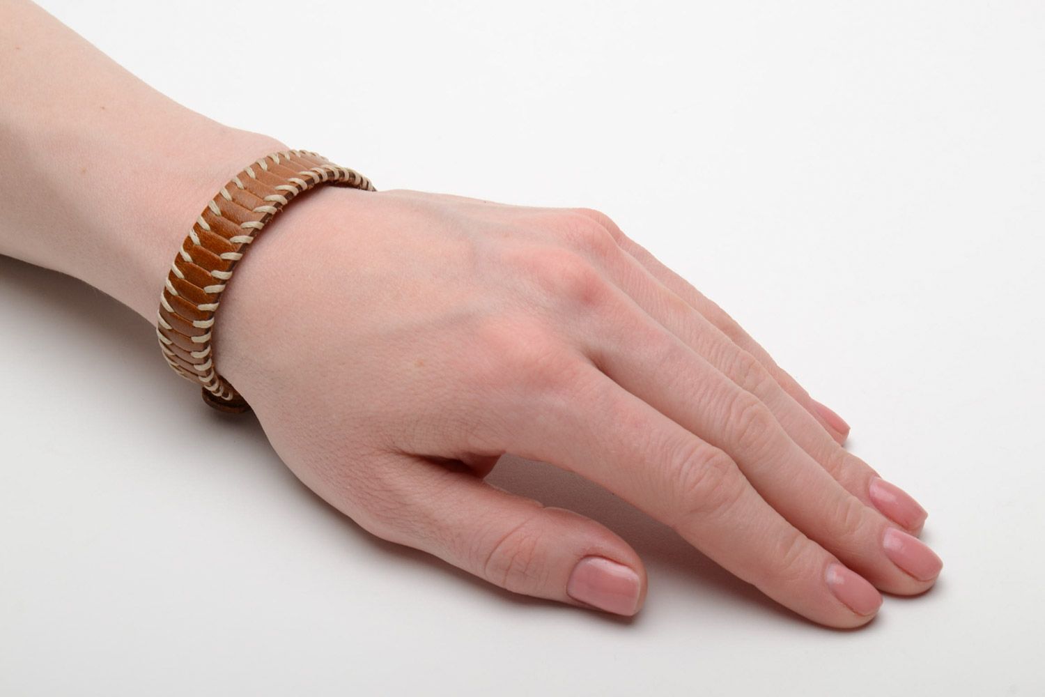 Thin handmade light brown genuine leather wrist bracelet with metal rivets photo 2