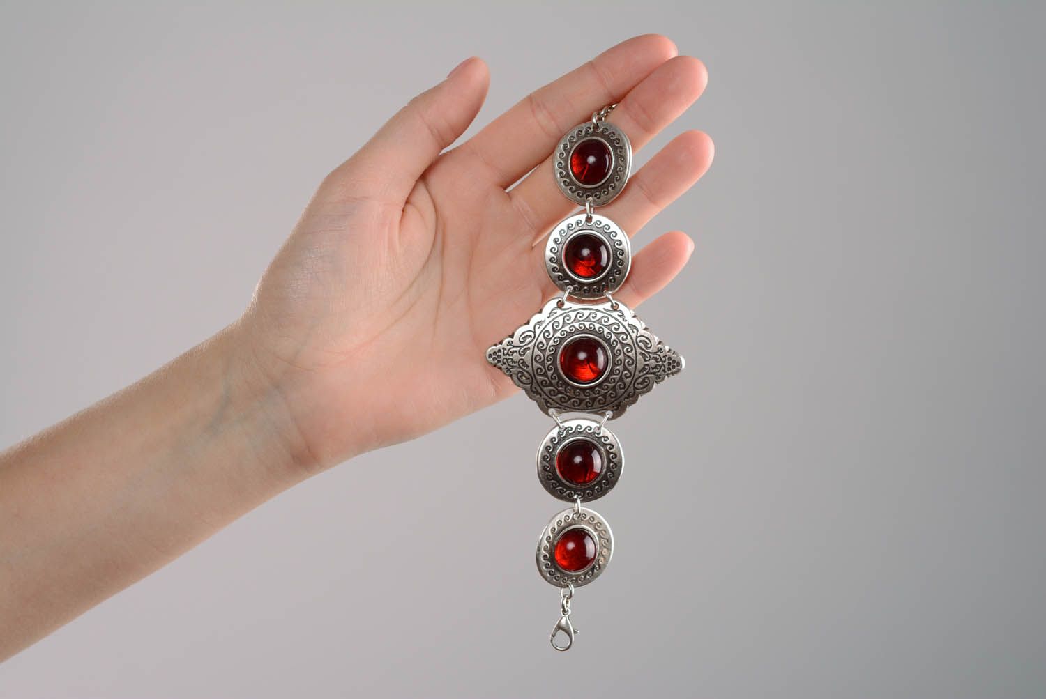 Silver bracelet with red beads photo 5