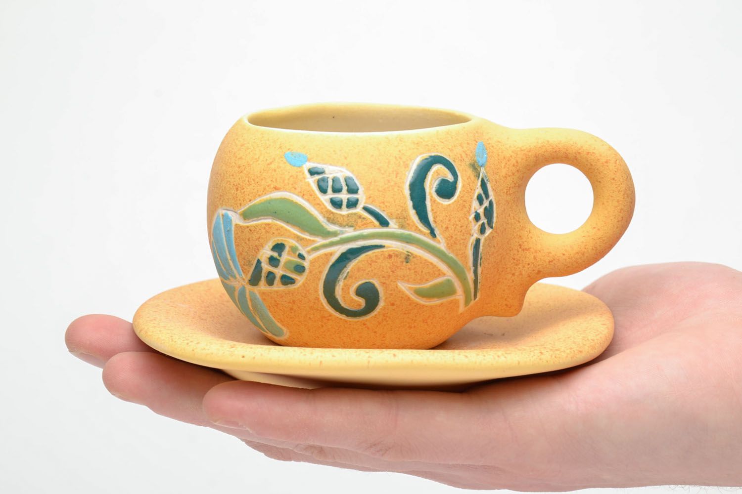 Clay yellow drinking cup with floral pattern with handle and saucer  photo 5