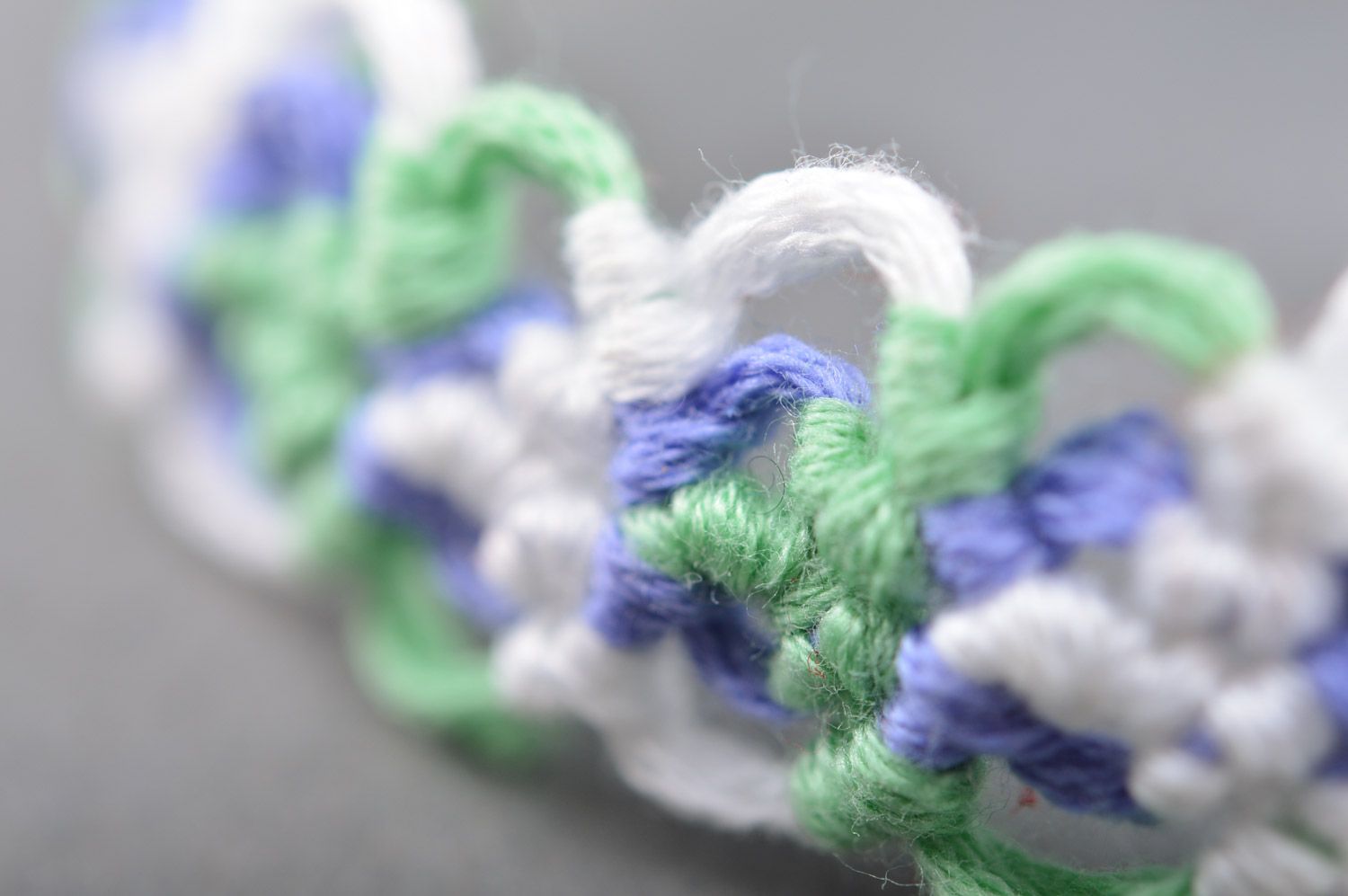 Thin handmade friendship wrist bracelet woven of embroidery floss in tender colors photo 4