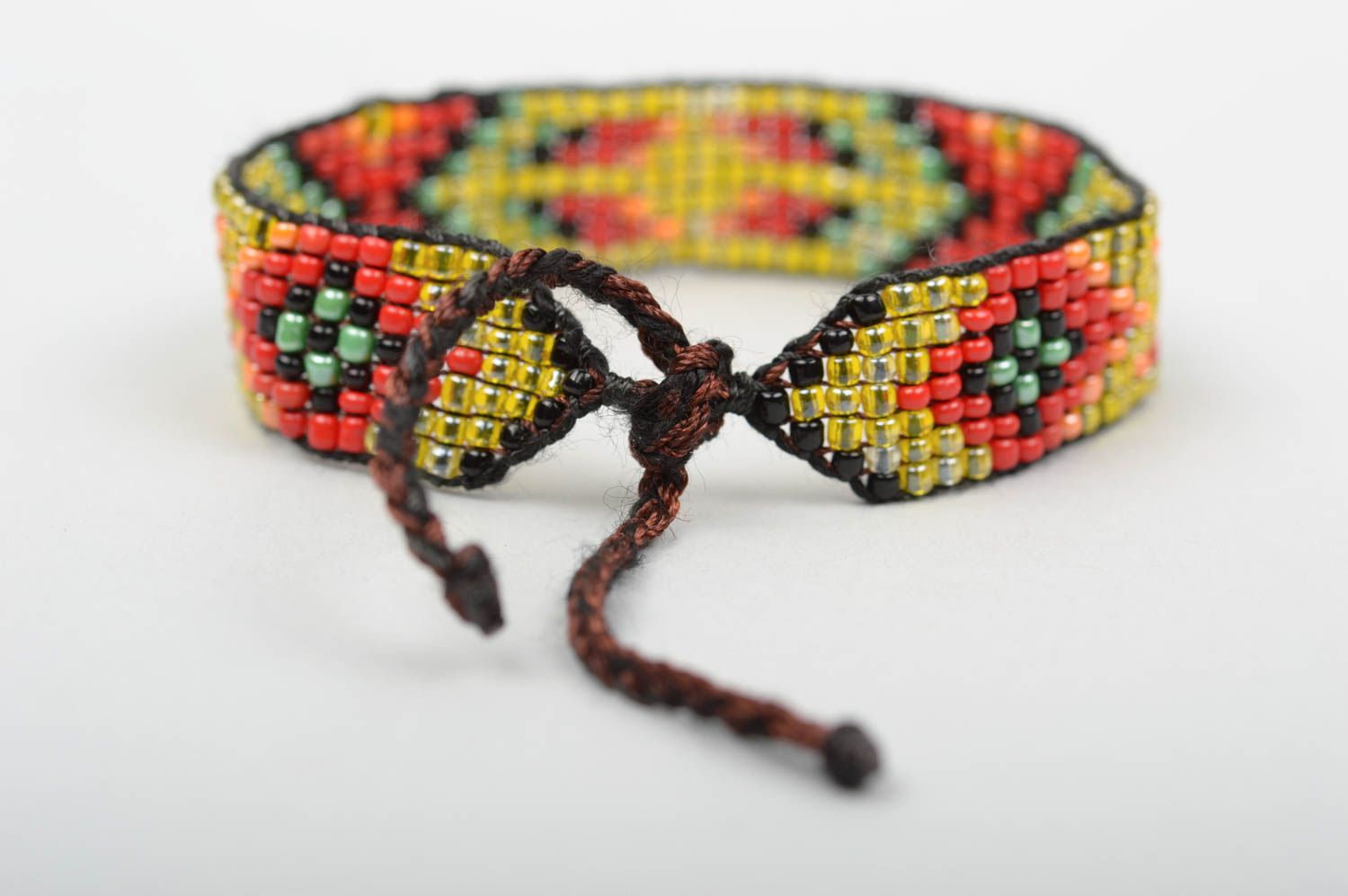 Handmade beaded strand bracelet with green, red, black beads for women photo 2