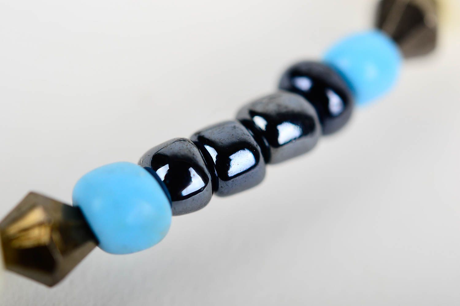 Elastic stretchy unisex bracelet made of black and blue beads  photo 4
