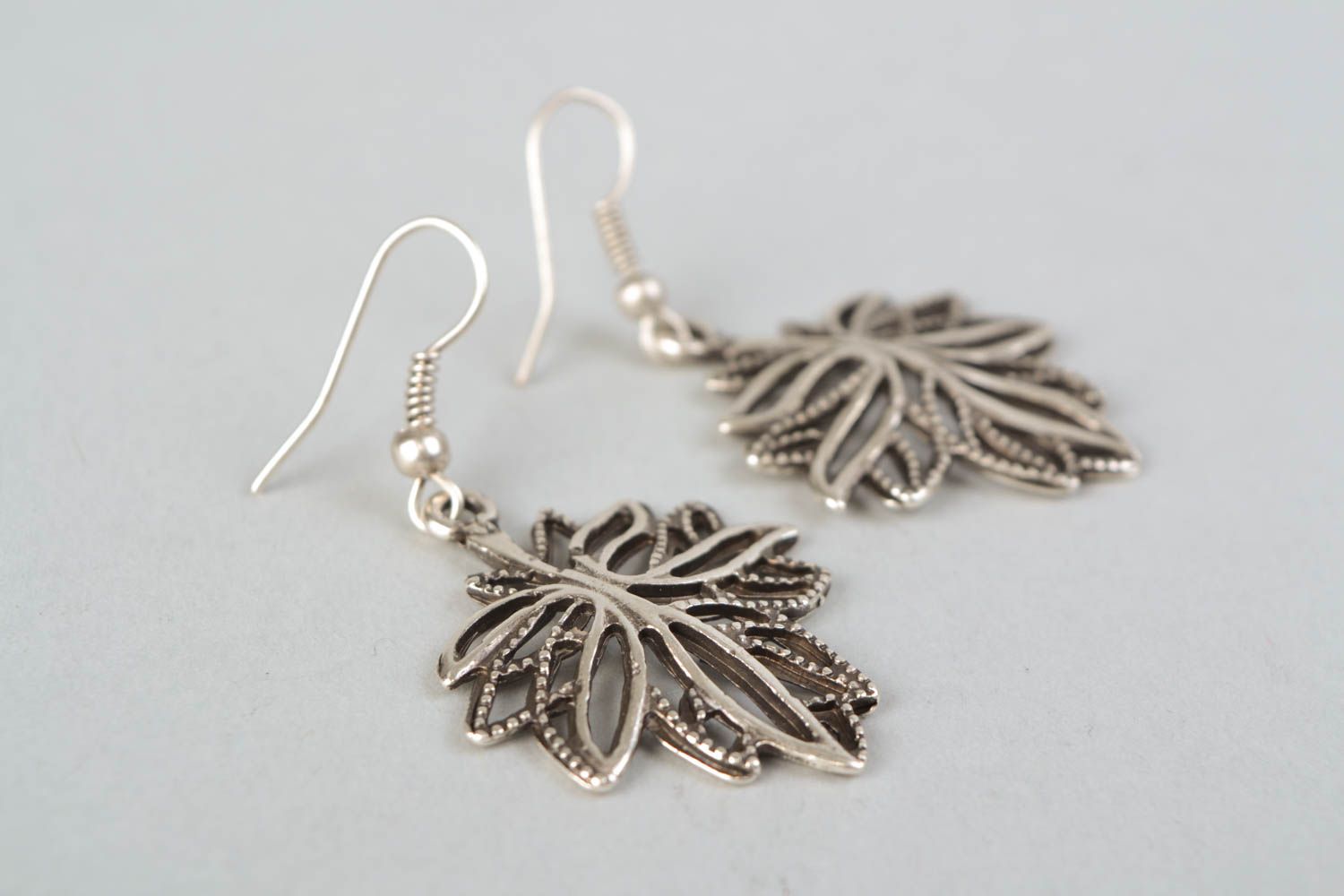 Handmade metal earrings in the shape of leaves photo 4