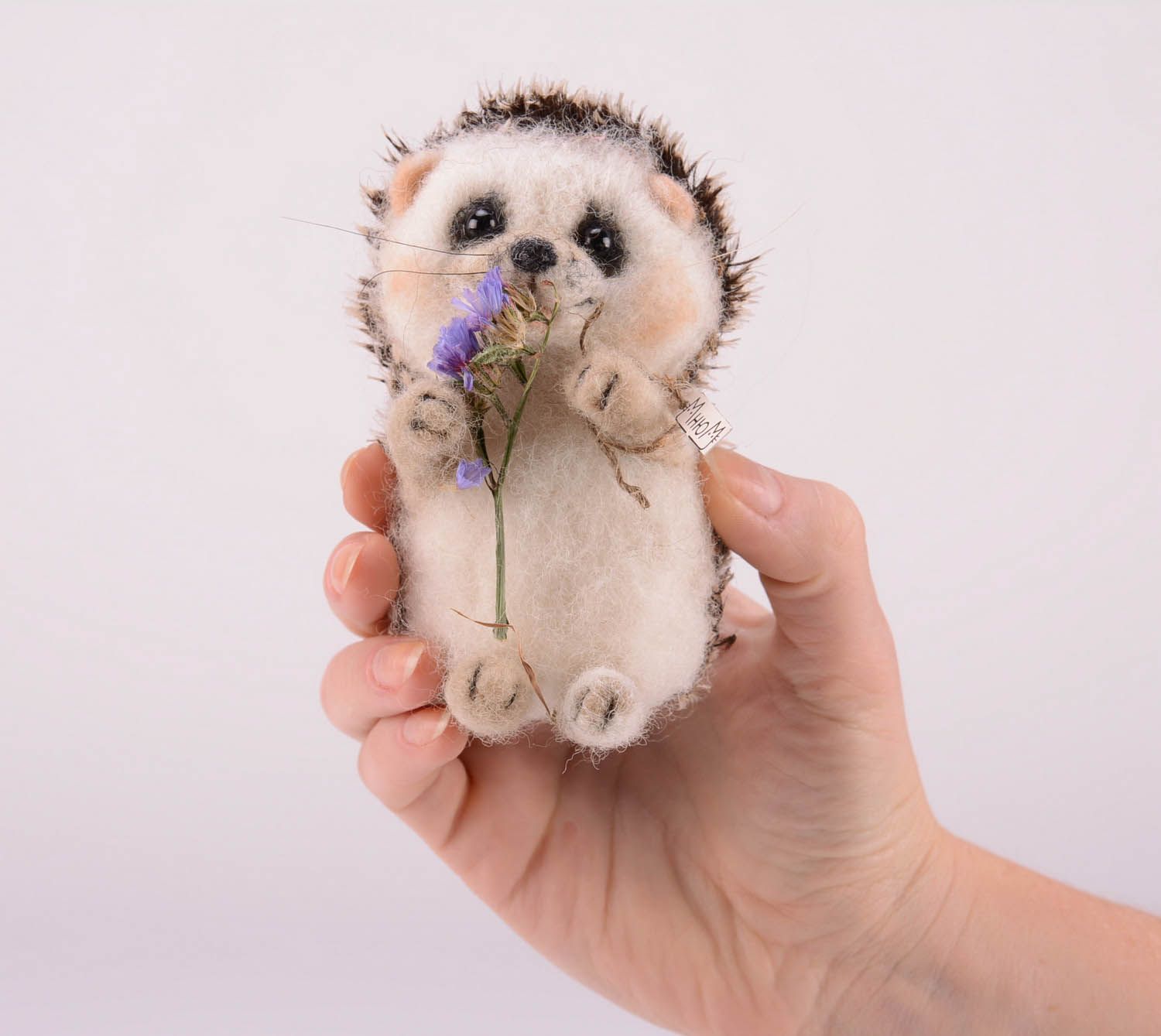 Toy made of felting wool Hedgehog with flower photo 2