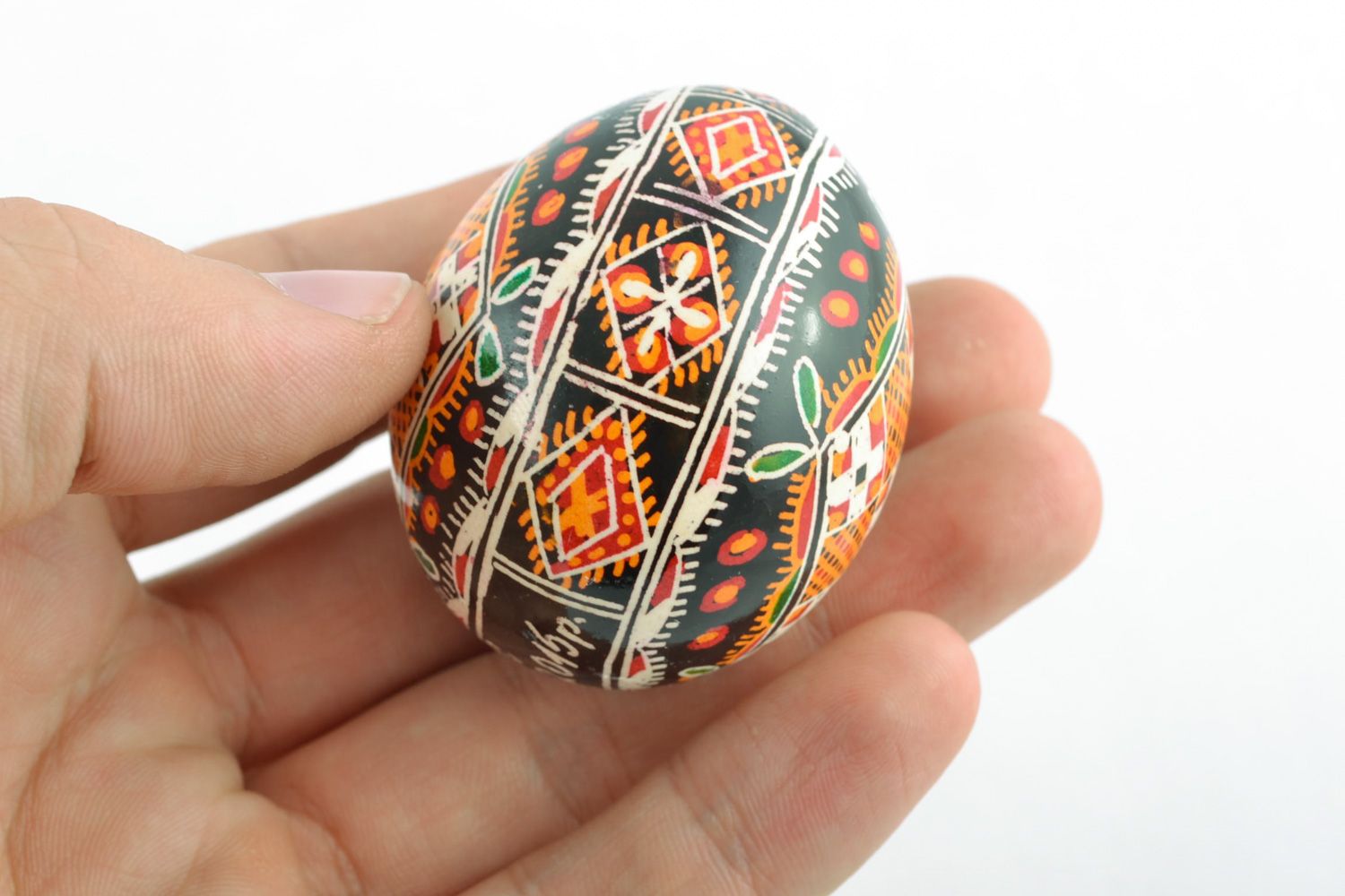 Homemade ornamented Easter egg pysanka with traditional painting made with hot wax photo 2