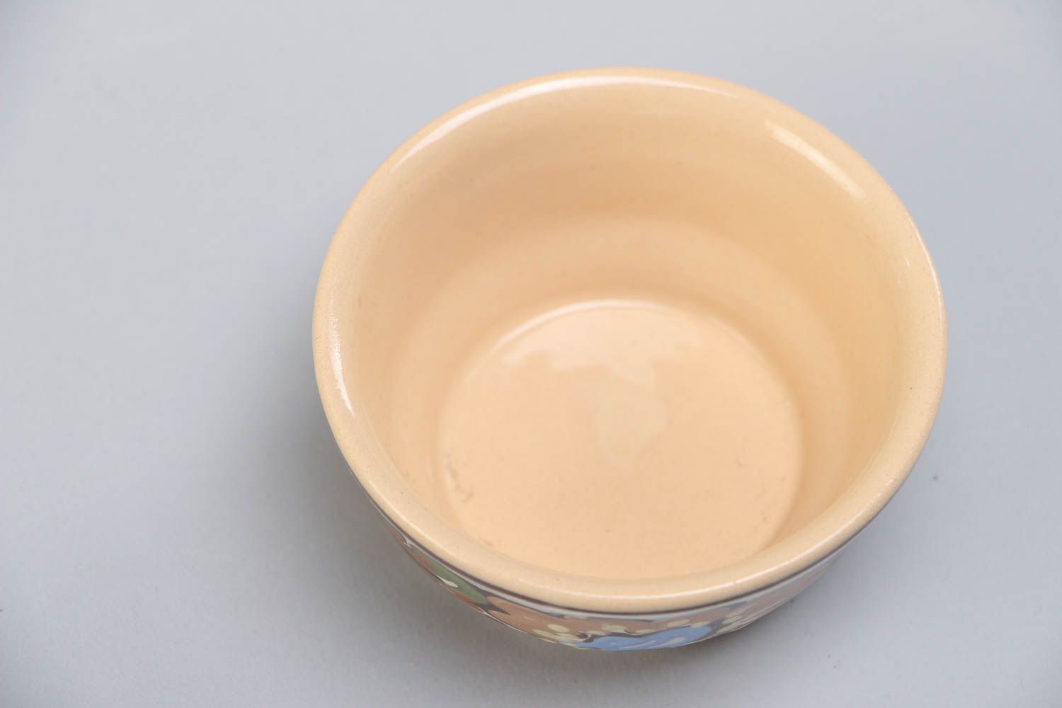Handmade decorative small ceramic bowl ornamented with colorful glaze for sauces photo 3