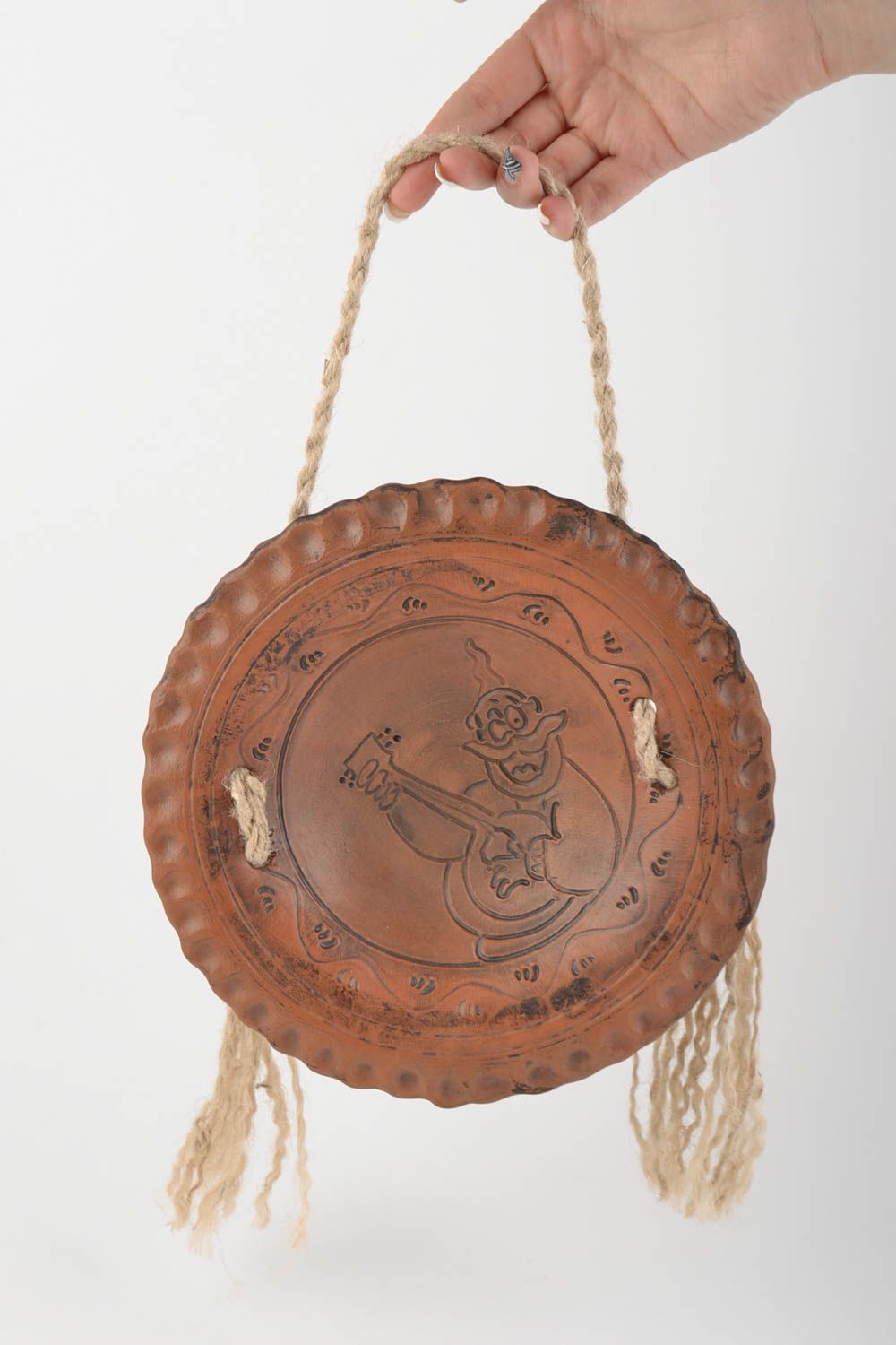 Unusual brown handmade round ceramic wall panel on rope photo 2