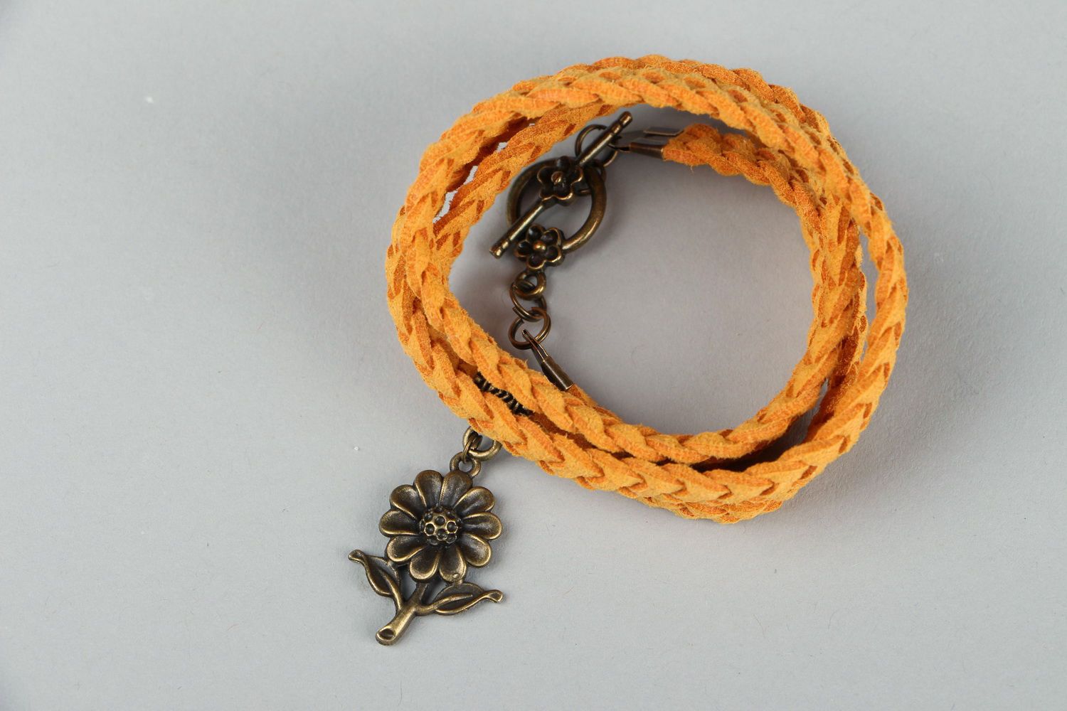 Suede braided bracelet with pendant photo 2