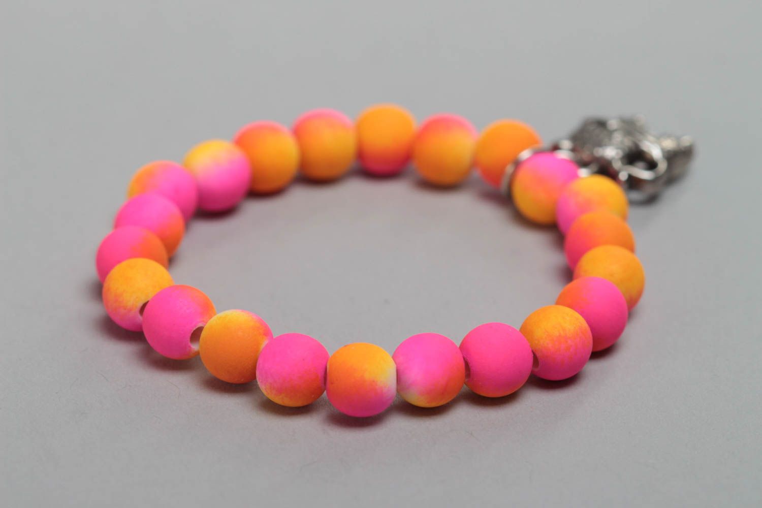 Bright pink handmade children's plastic bead bracelet with charm photo 3