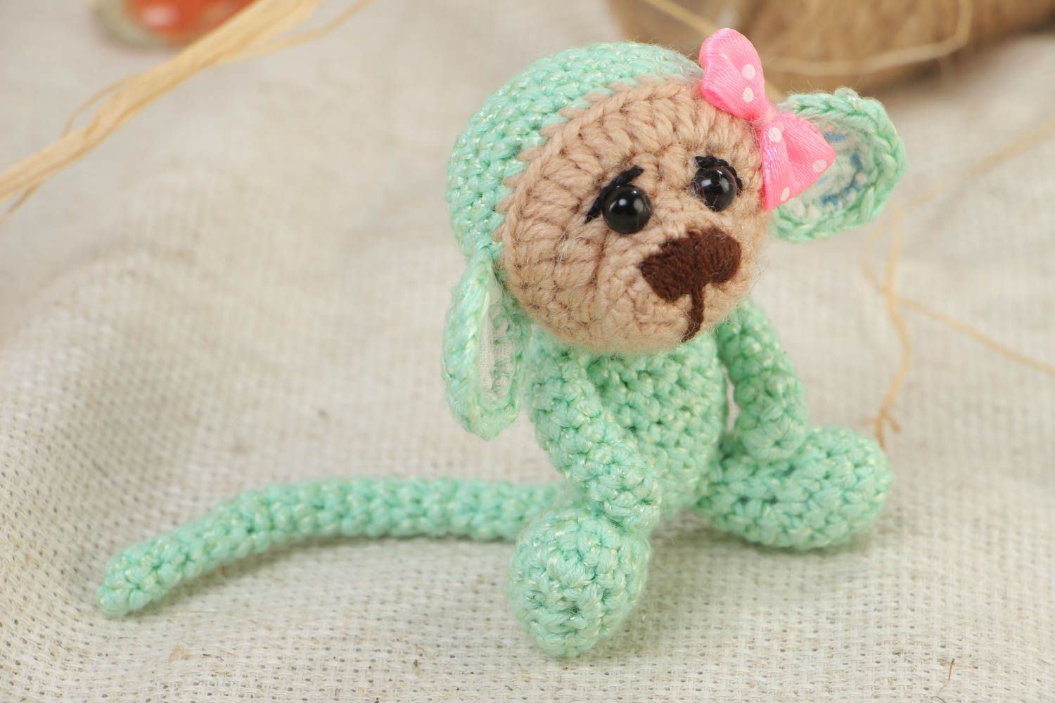 Handmade small funny soft toy crocheted of acrylic threads Green Monkey with bow photo 1