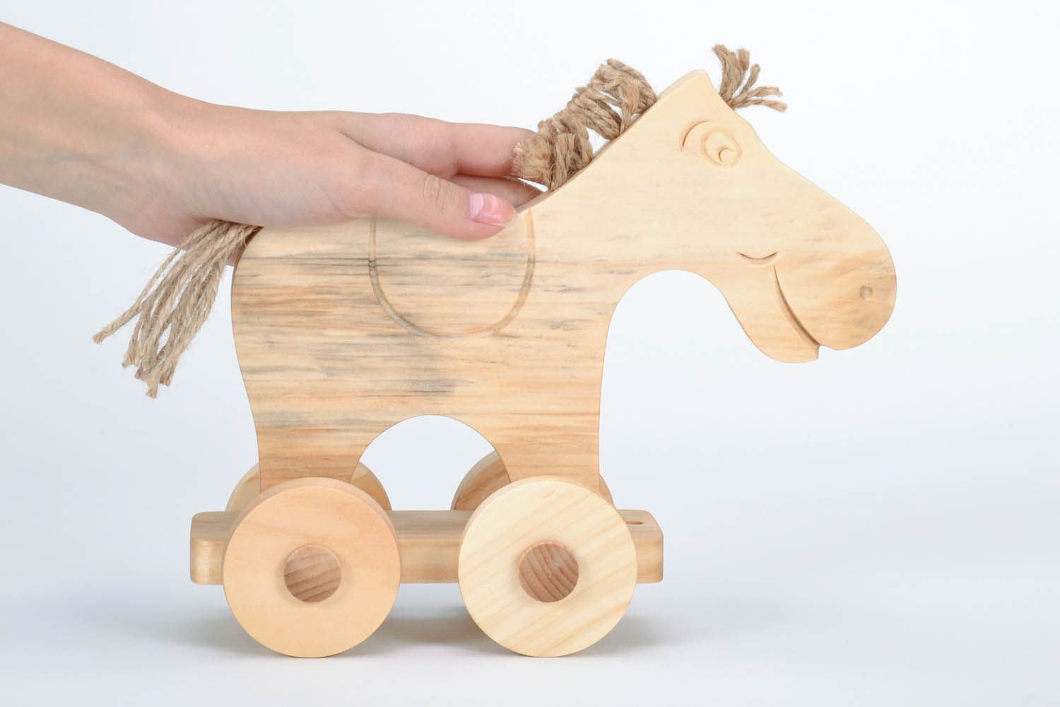 Holzspielzeug Pferd auf Rädern foto 5