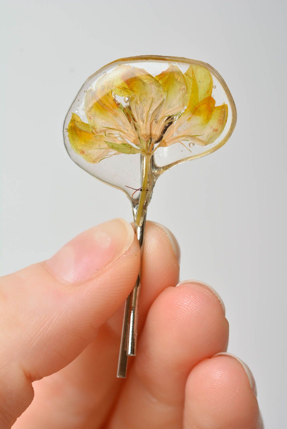 Handmade decorative metal hair pin with yellow dried flower in epoxy resin photo 2