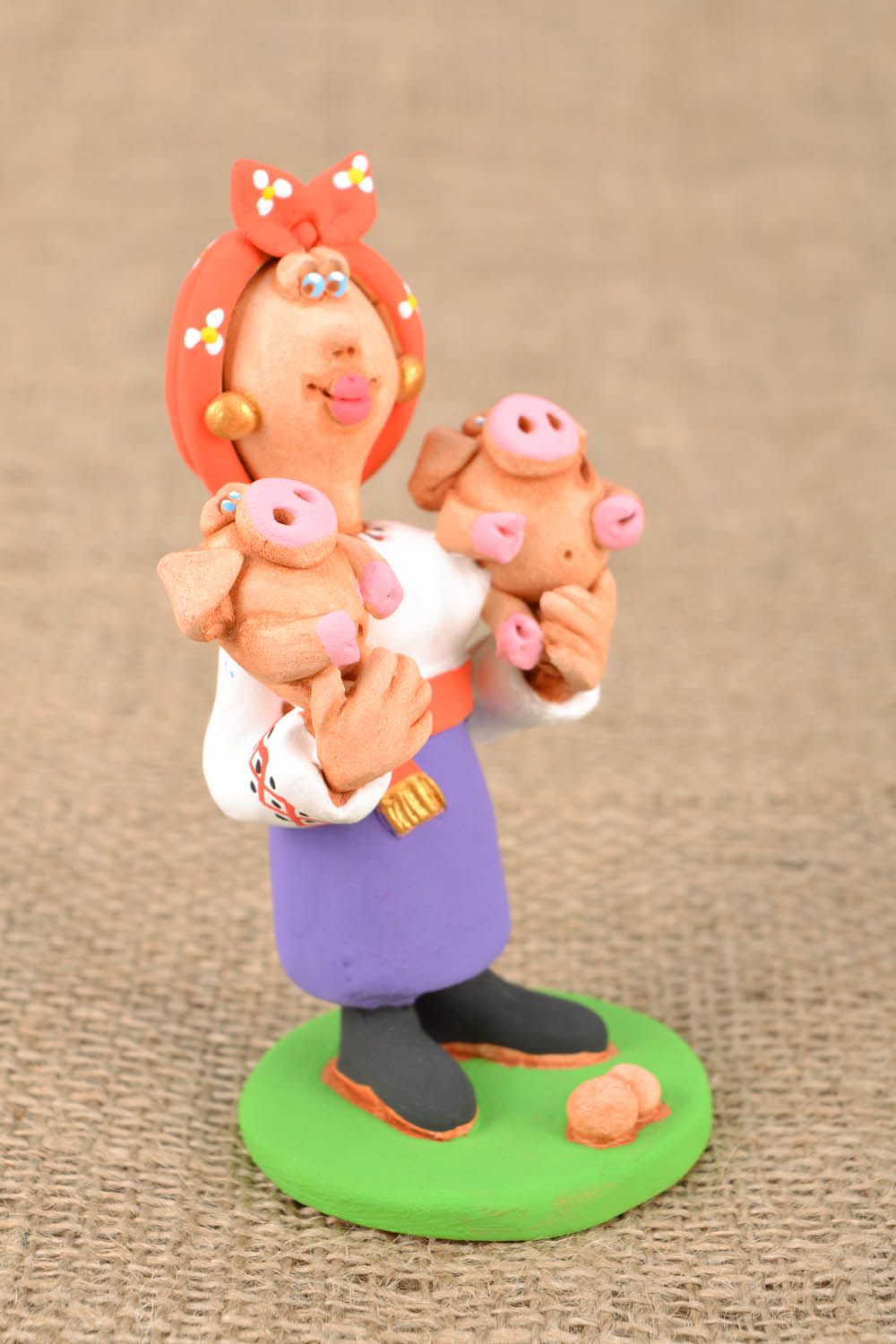 Clay figurine Cossack woman with piggies photo 1