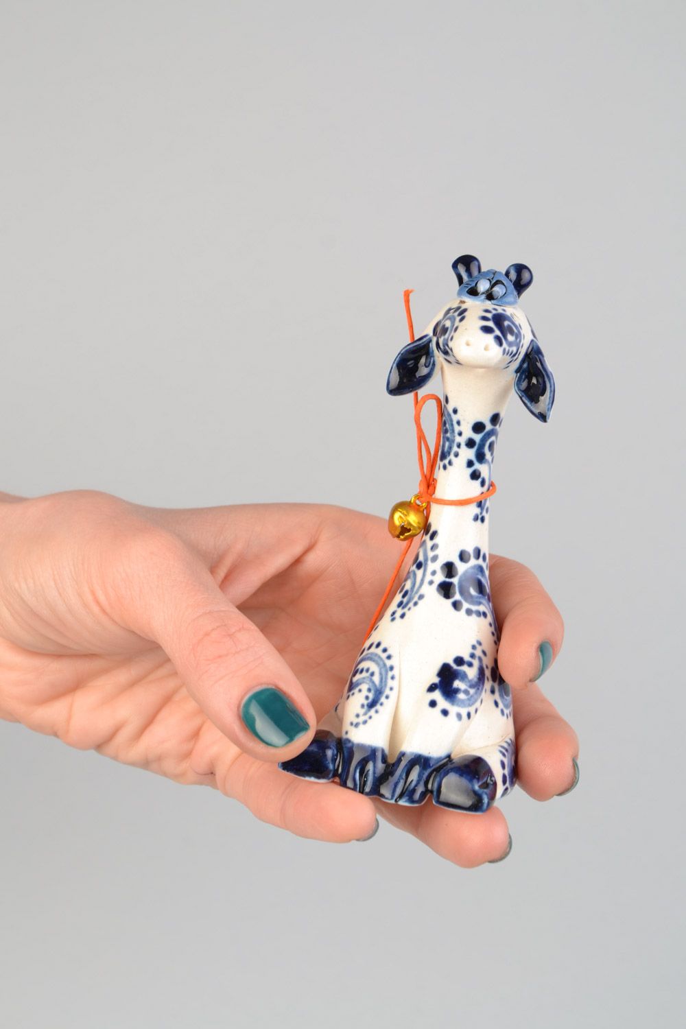 Handmade small ceramic figurine of giraffe painted with white and blue glaze photo 2