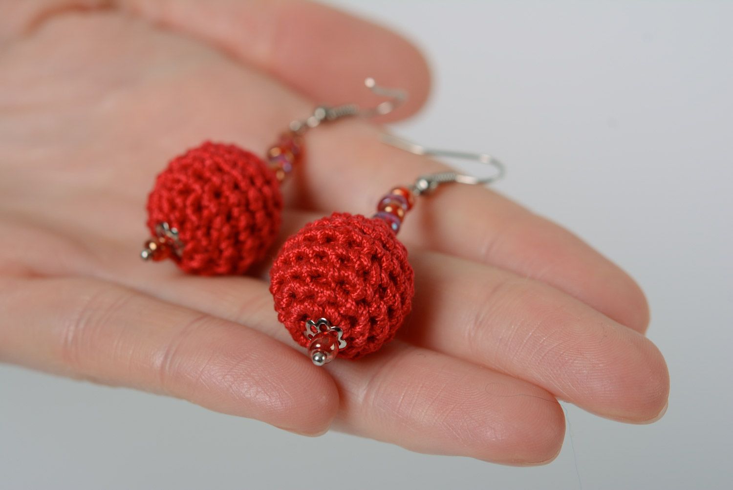 Handmade round dangle earrings with beads crocheted over with red cotton threads photo 2
