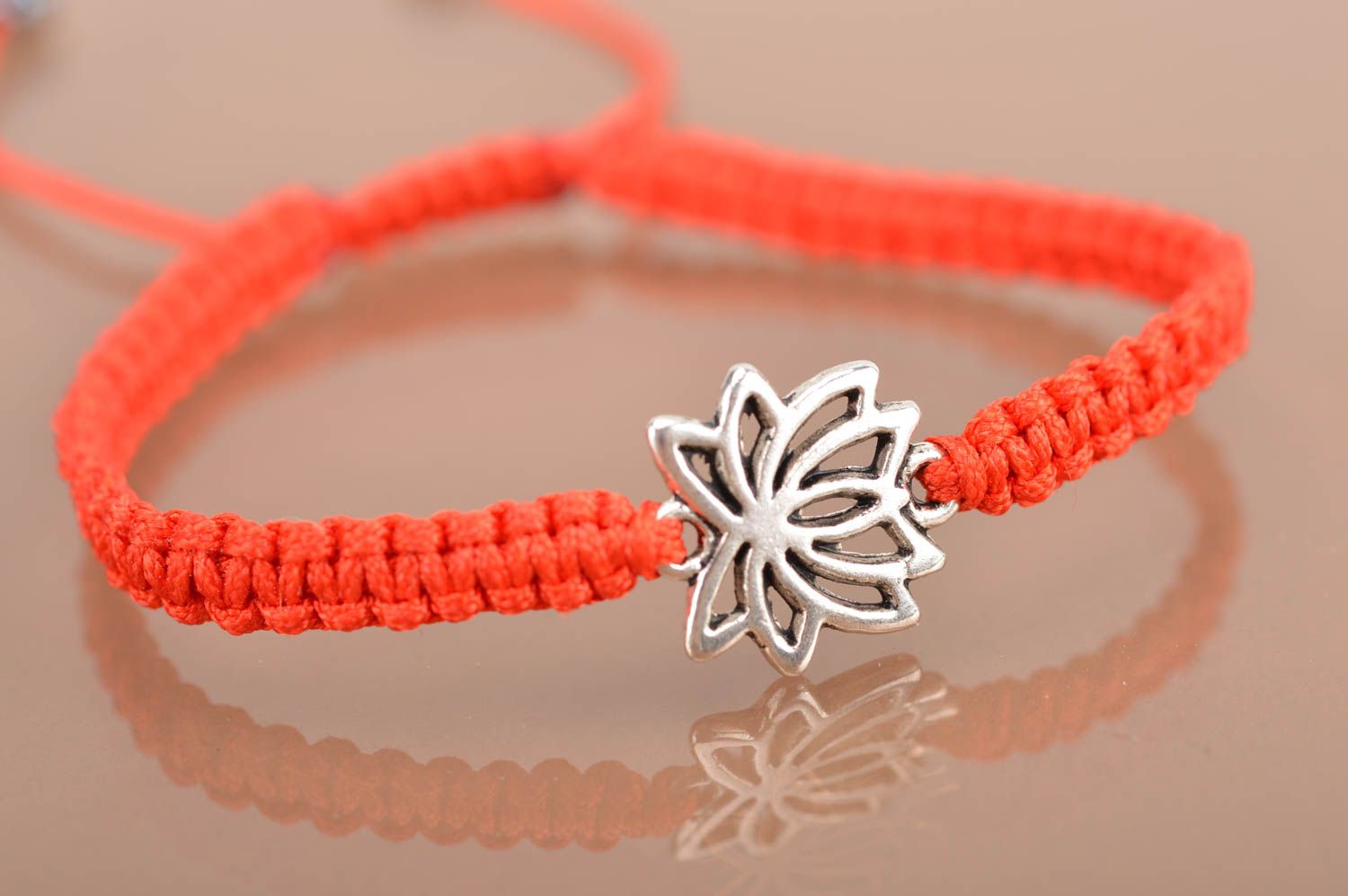 Beautiful handmade red woven silk thread bracelet with metal insert Lotus photo 2