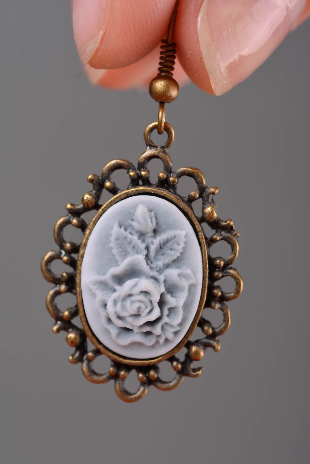Handmade designer polymer clay cameo oval dangling earrings with metal frame photo 2