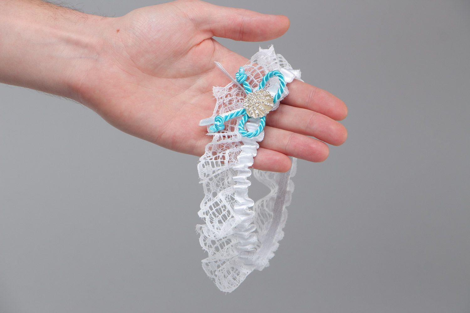 Tender handmade white stretch lace wedding bridal garter with blue cord and bead photo 5