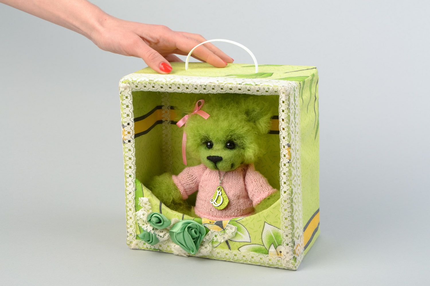 Handmade collectible crocheted soft toy bear in a box of light green color photo 2