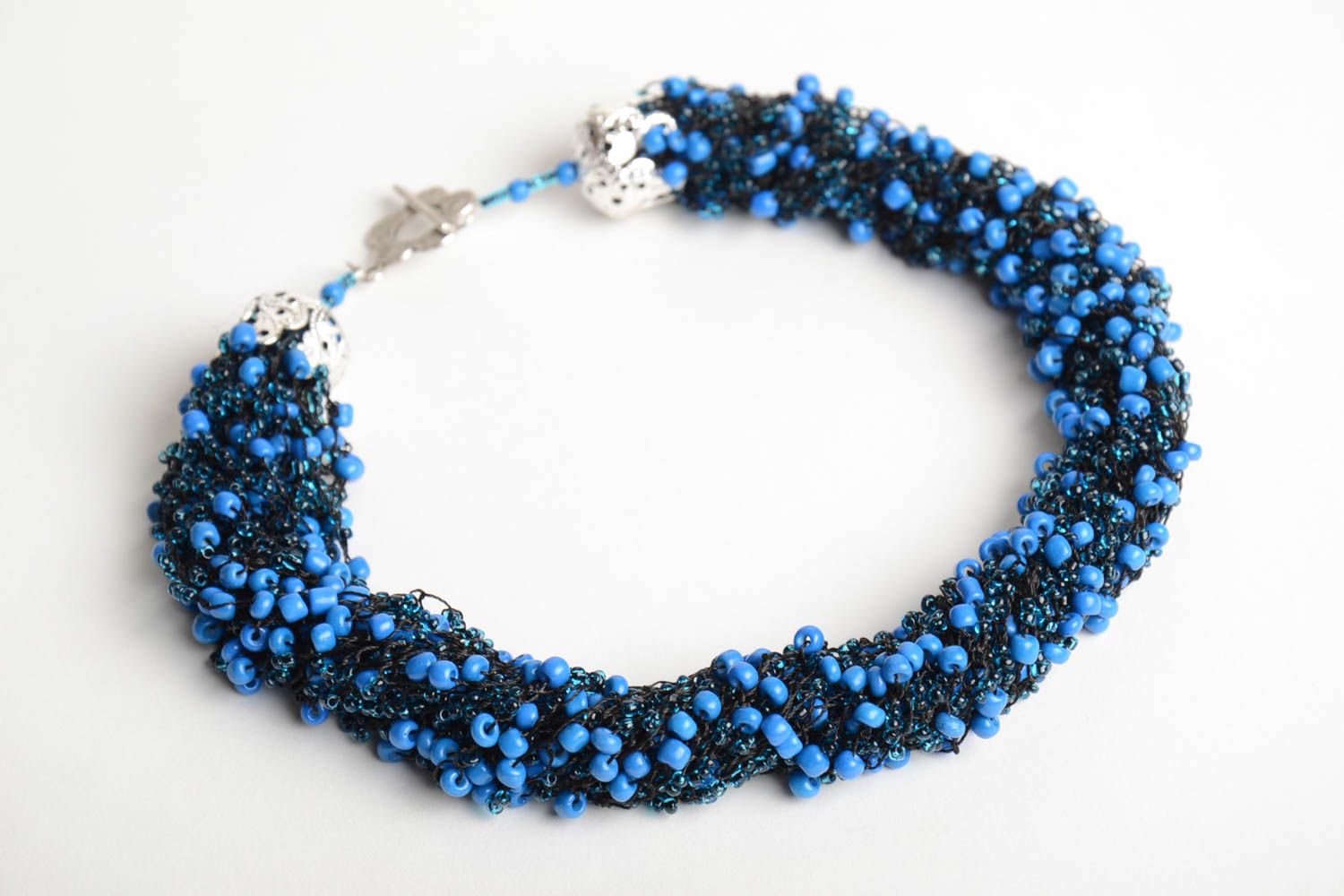 Handmade massive volume necklace crocheted of beads in dark blue color palette photo 3