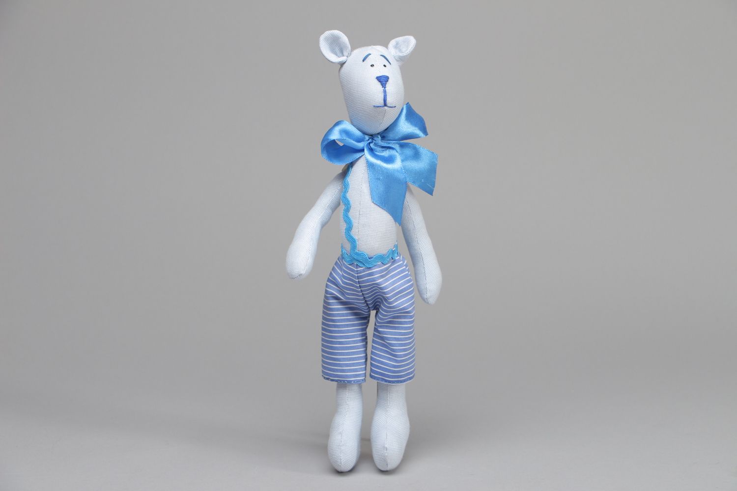 Textile toy bear with bow on the neck photo 1
