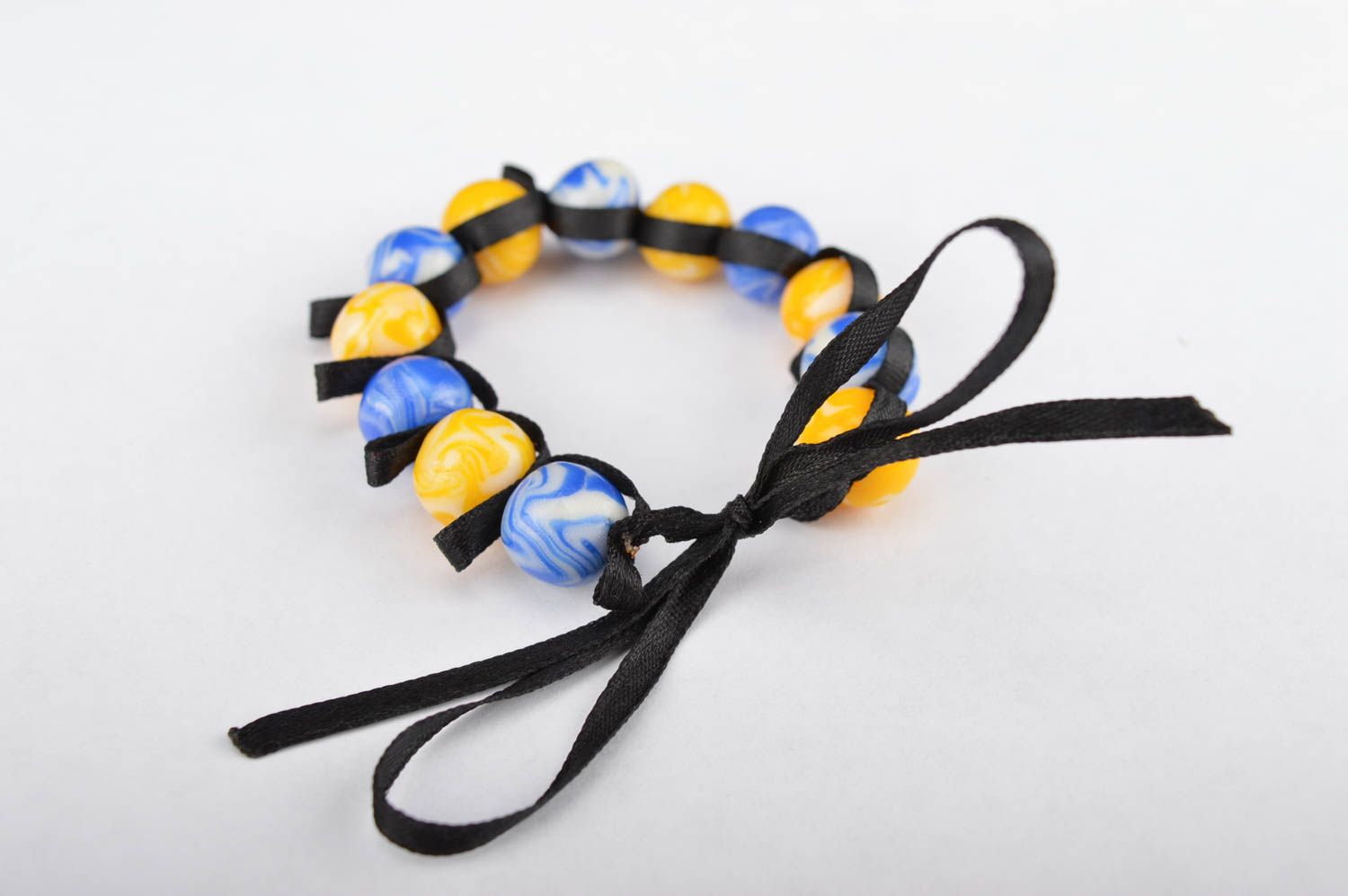 Stylish handmade yellow and blue beads bracelet on a black textile cord for her photo 4