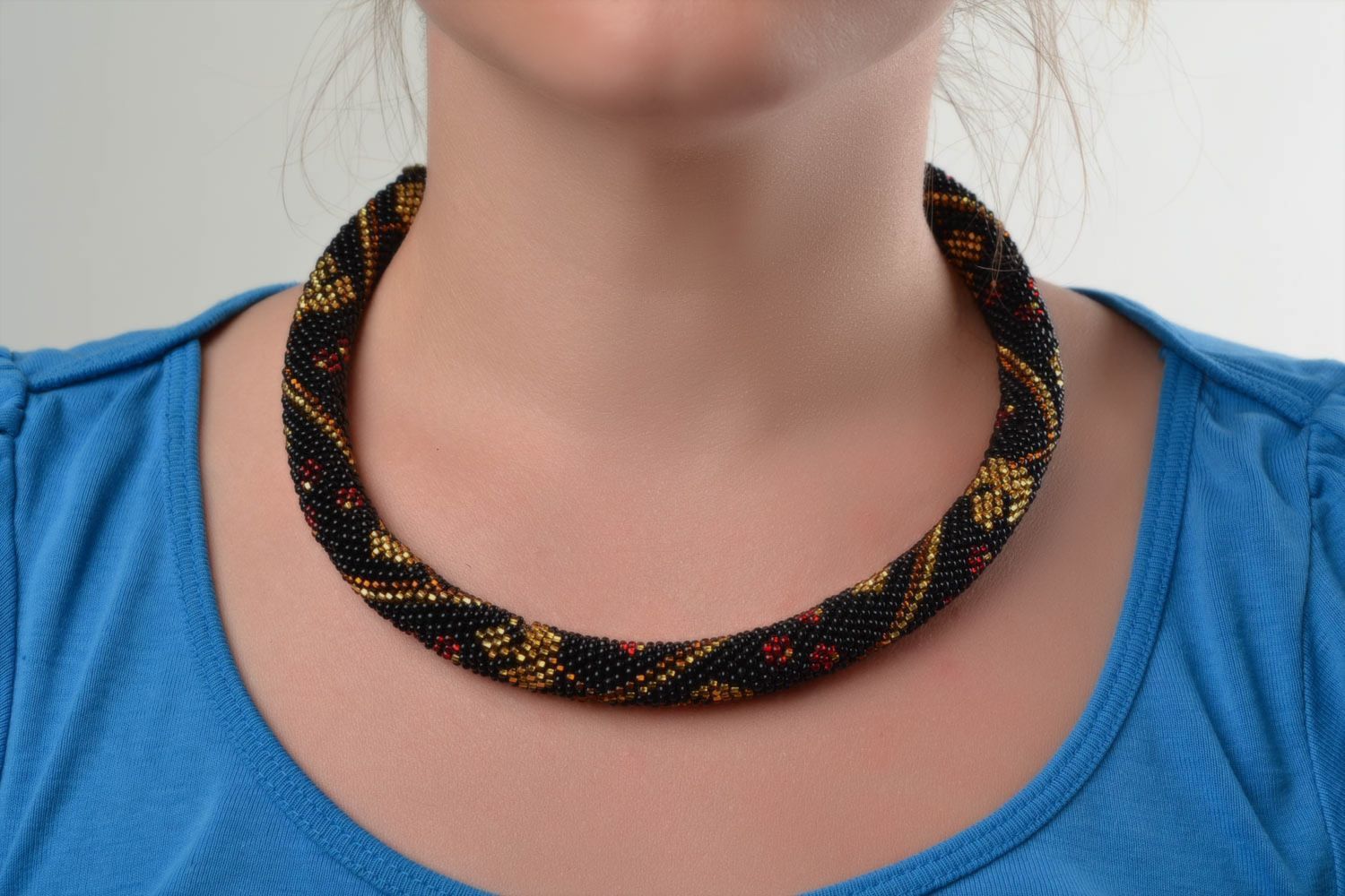 Beautiful handmade woven beaded cord necklace of black and golden colors women's photo 1