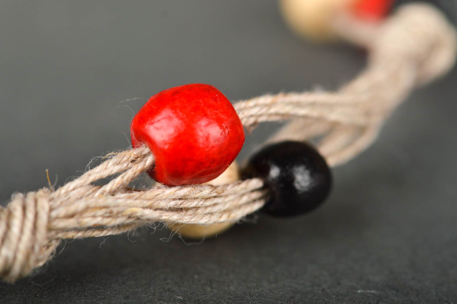 Strand beige rope two-row bracelet with red, black, white, yellow wooden beads for women photo 4