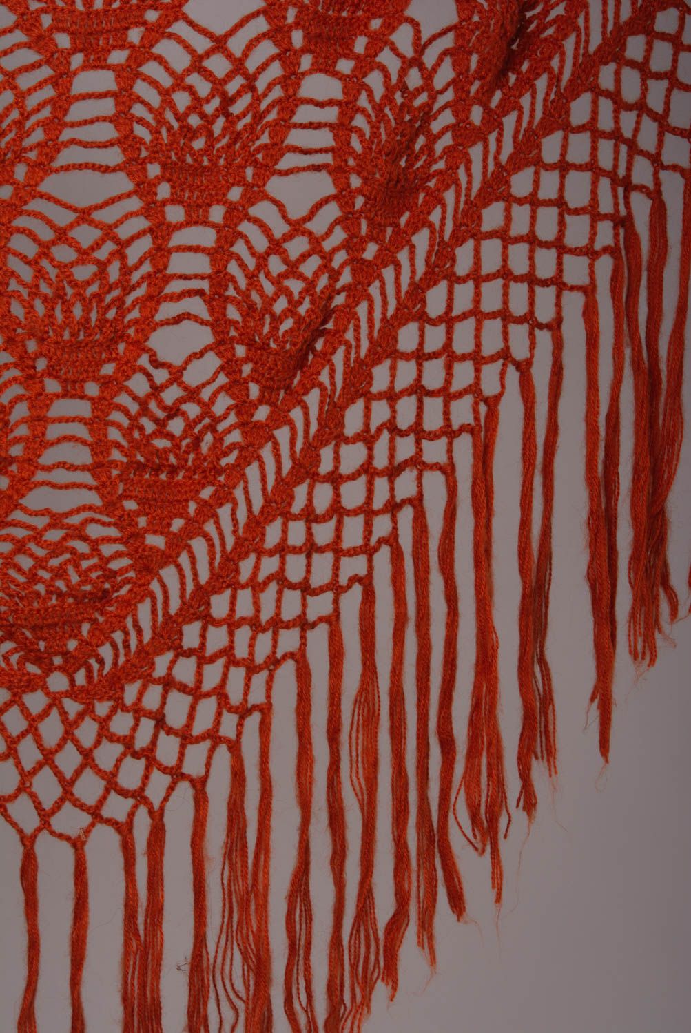 Handmade warm lace women's shawl knitted of wool of bright orange color photo 3